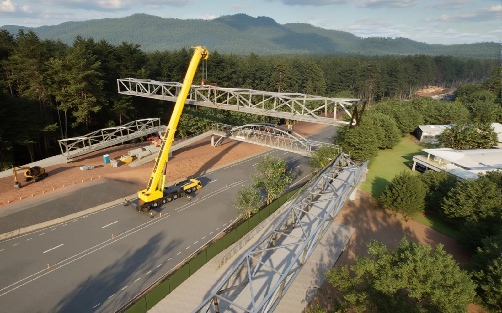 A crane lifting a steel pedestrian bridge truss into place across the closed Pacific Highway